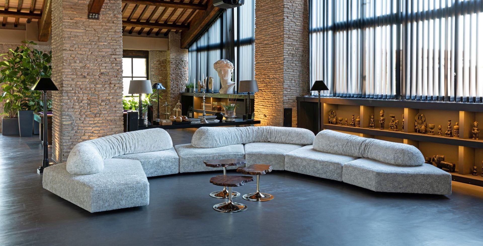 Edra On the Rocks sofa in a brick and timber interior